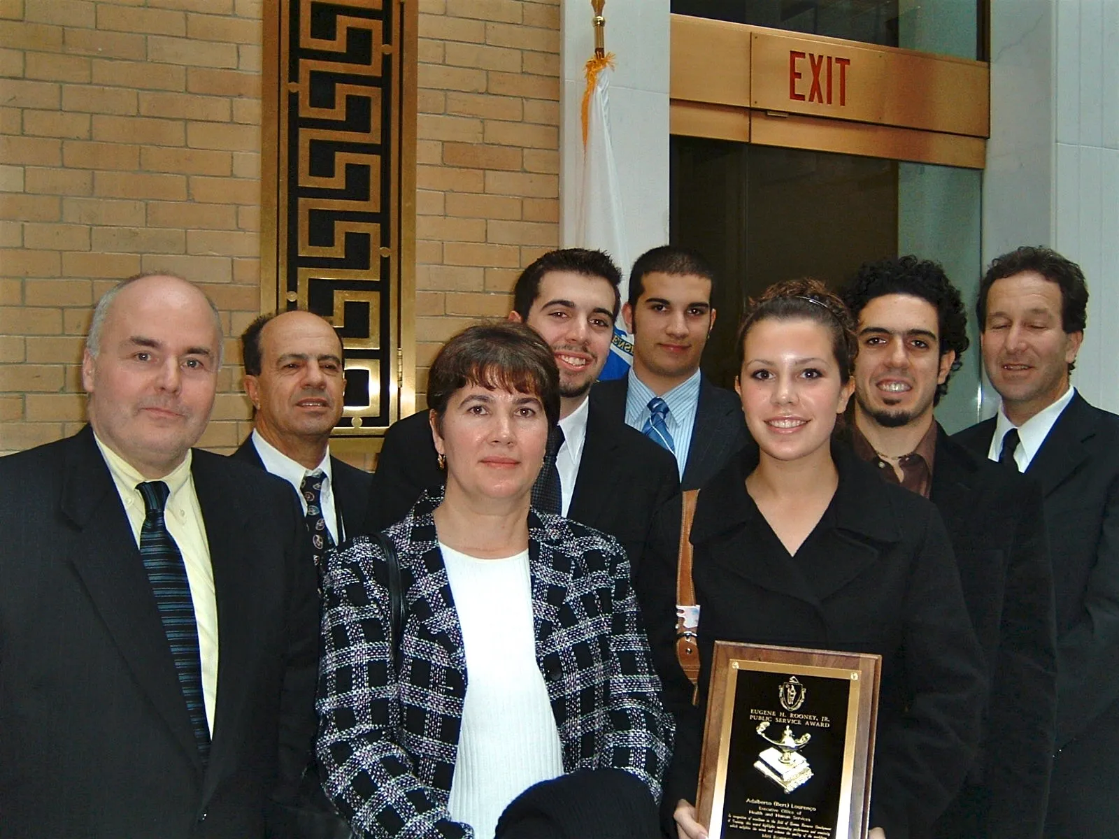 The Lourenço family and colleagues with the Rooney Award plaque at the Great Hall of the State House, November 2004
